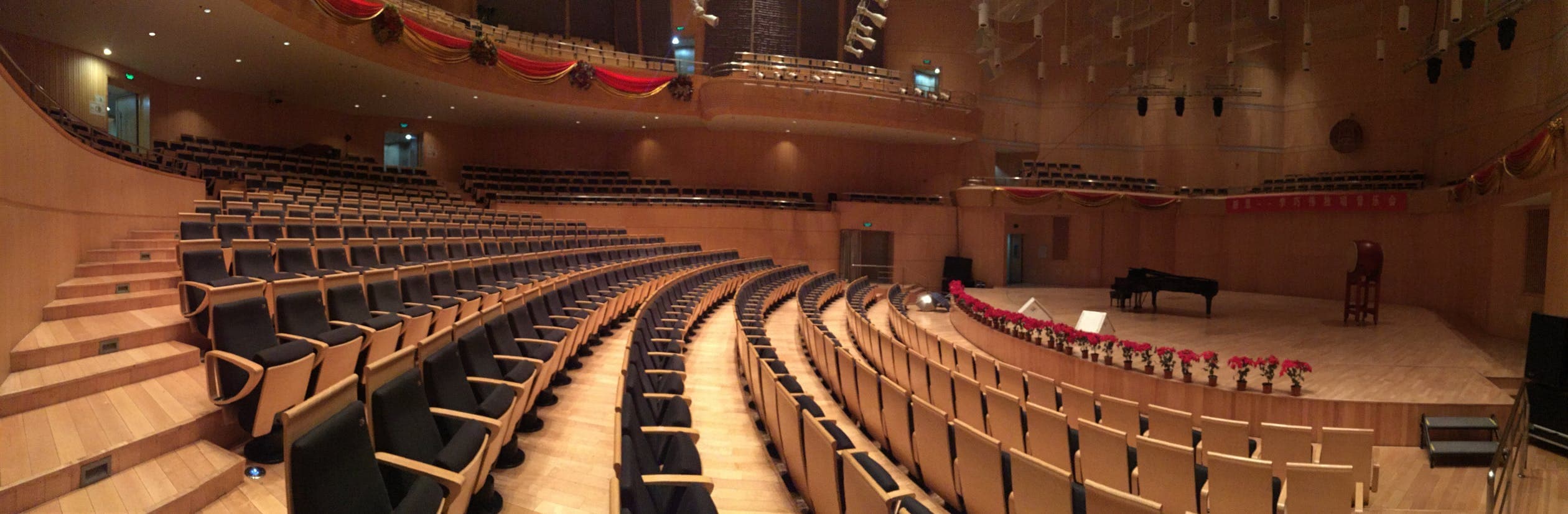 Grand piano on a concert hall stage